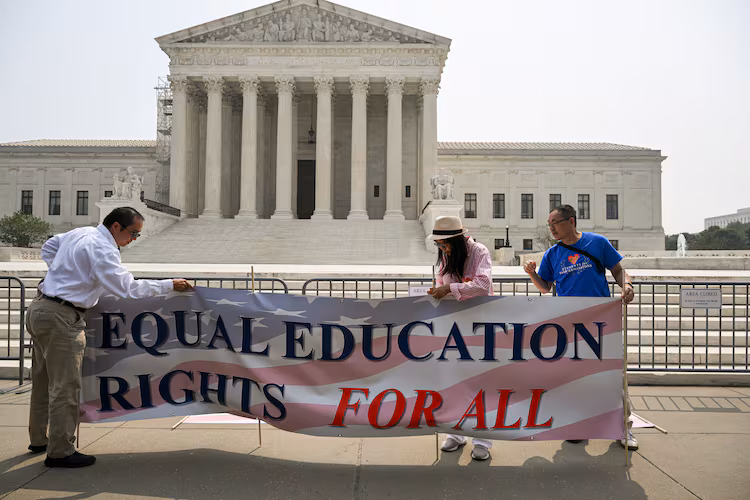 Activists from Students for Fair Admissions celebrate the affirmative action opinion outside the U.S. Supreme Court in Washington, June 29, 2023. The group that successfully sued Harvard to end affirmative action in university admissions last year is now threatening to investigate whether schools are complying with the new rules and to file lawsuits if it believes that they are not. (Kenny Holston/The New York Times)