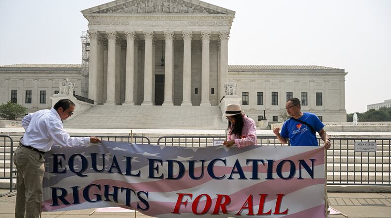 Activists from Students for Fair Admissions celebrate the affirmative action opinion outside the U.S. Supreme Court in Washington, June 29, 2023. The group that successfully sued Harvard to end affirmative action in university admissions last year is now threatening to investigate whether schools are complying with the new rules and to file lawsuits if it believes that they are not. (Kenny Holston/The New York Times)
