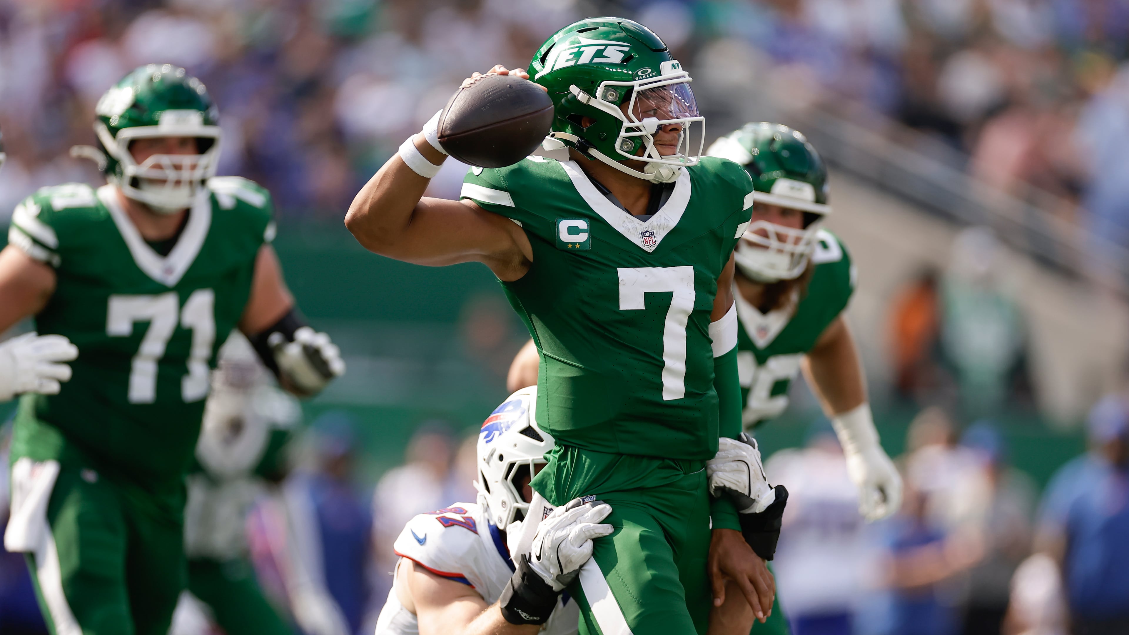 New York Jets quarterback Justin Fields (7) is sacked by Buffalo Bills defensive end Joey Bosa (97) during the fourth quarter of an NFL football game, Sunday, Sept. 14, 2025, in East Rutherford, N.J. (AP Photo/Adam Hunger)