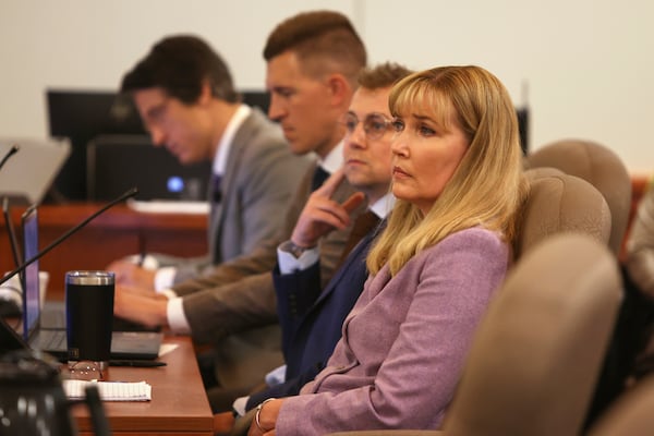 Minnesota state Sen. Nicole Mitchell, D-Woodbury, listens to the state's closing arguments during the fifth day of her felony burglary trial on Friday, July 18, 2025, at Becker County District Court in Detroit Lakes. To the right of Sen. Mitchell are her attorneys Matthew Keller, Dane DeKrey and Bruce Ringstrom Jr. (Anna Paige/The Forum via AP, Pool)