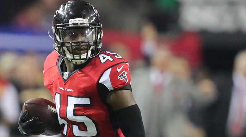 Falcons linebacker Deion Jones intercepts Seahawks quarterback Russell Wilson in the final minutes of the fourth quarter to seal a 36-20 victory in the NFC divisional playoff game Saturday, Jan. 14, 2017, in Atlanta.