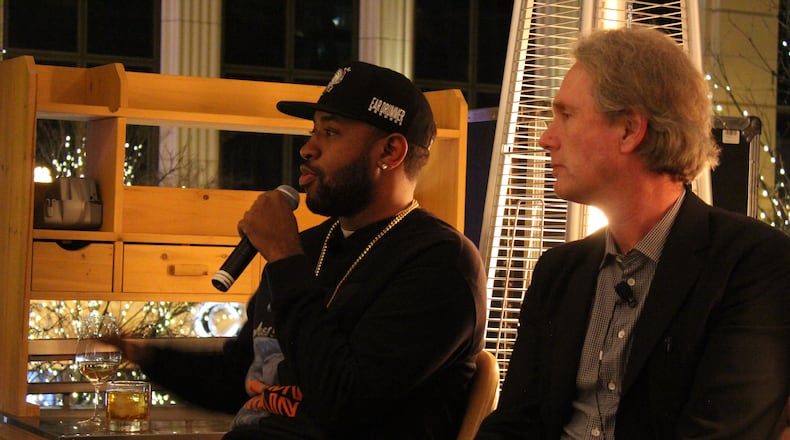 Mike Will Made It and John Seabrook addressing the Atlanta Press Club Tuesday at Dolce Italian restaurant. Photo: Melissa Ruggieri/AJC