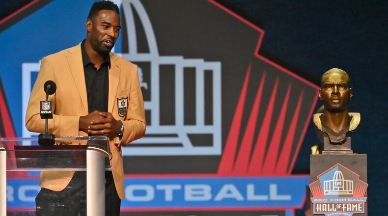 Calvin Johnson, a member of the Pro Football Hall of Fame Class of 2021, speaks during the induction ceremony at the Pro Football Hall of Fame, Sunday, Aug. 8, 2021, in Canton, Ohio. (David Richard/AP)