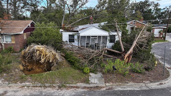 In this aerial view, a tree lays on top of a home as the area recovers from the aftermath of Hurricane Helene on October 05, 2024 in Augusta, Georgia. (Joe Raedle/Getty Images)