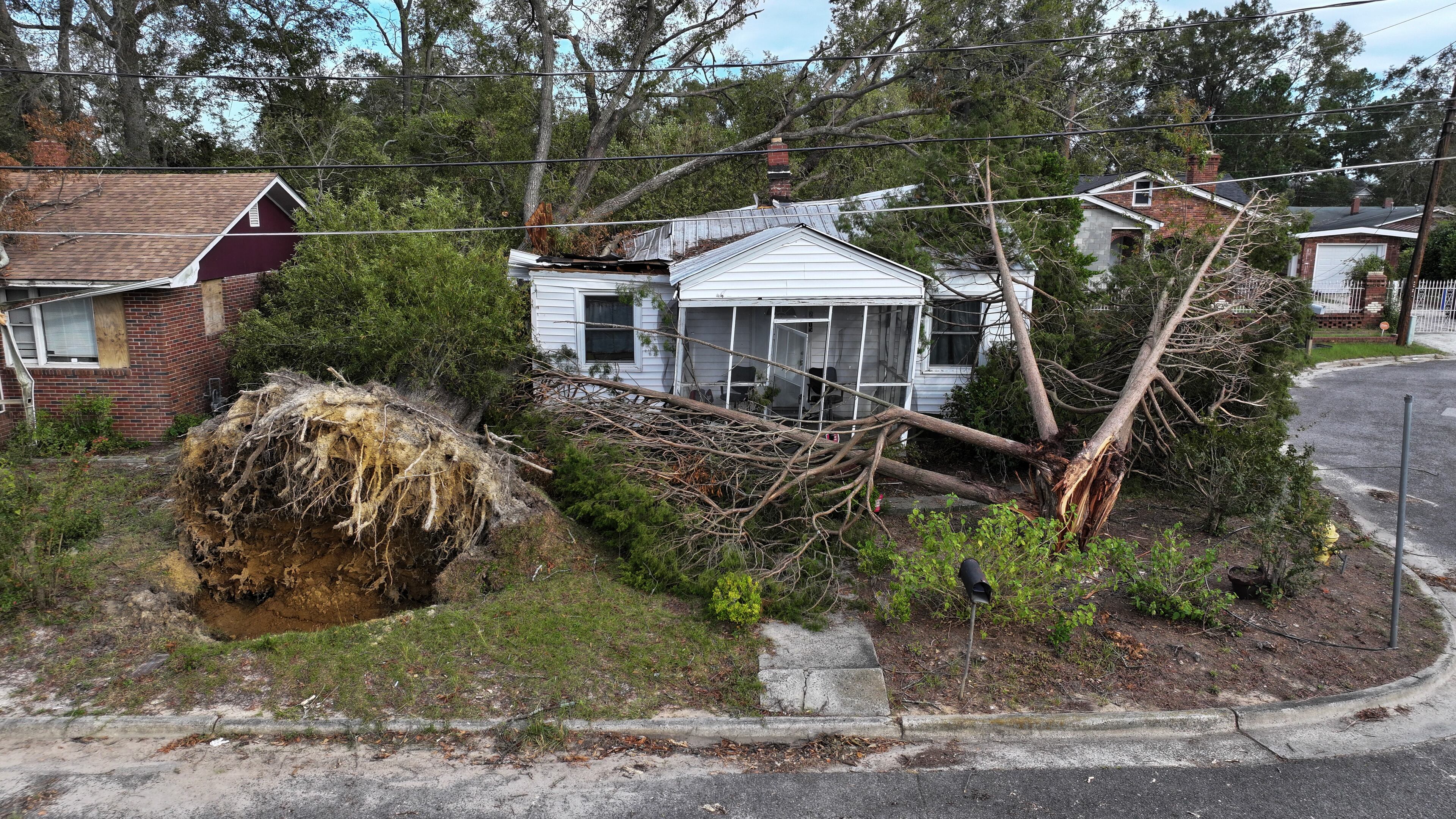 In this aerial view, a tree lays on top of a home as the area recovers from the aftermath of Hurricane Helene on October 05, 2024 in Augusta, Georgia. (Joe Raedle/Getty Images)