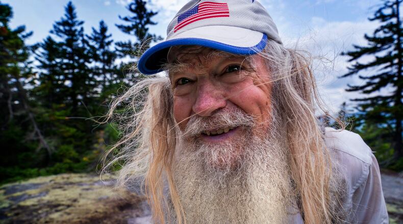M.J. Eberhart, 83, arrives on the summit of Mount Hayes on the Appalachian Trail in Gorham, New Hampshire. Eberhart, who goes by the trail name of Nimblewill Nomad, is the oldest person to hike the entire 2,193-mile Appalachian Trail. (AP Photo/Robert F. Bukaty)