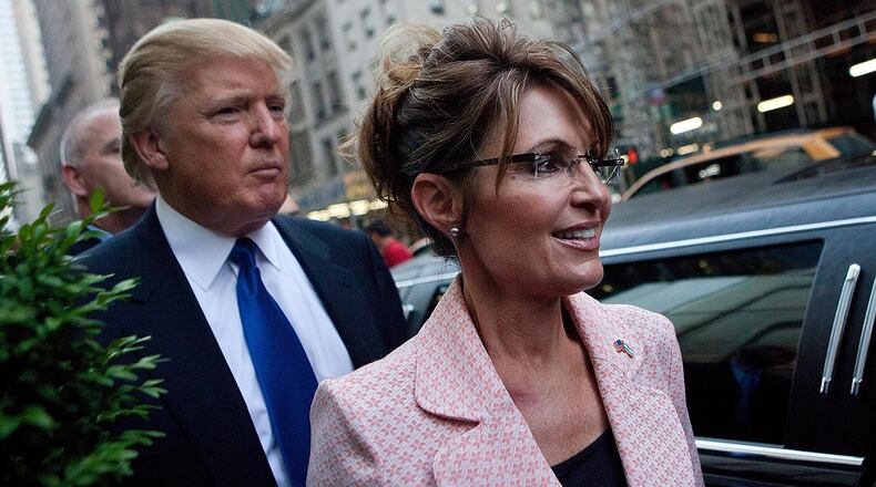 NEW YORK, NY - MAY 31: Former U.S. Vice presidential candidate and Alaska Governor Sarah Palin (R), and Donald Trump walk towards a limo after leaving Trump Tower, at 56th Street and 5th Avenue, on May 31, 2011 in New York City. Palin and Trump met for a dinner meeting in the city. (Photo by Andrew Burton/Getty Images)