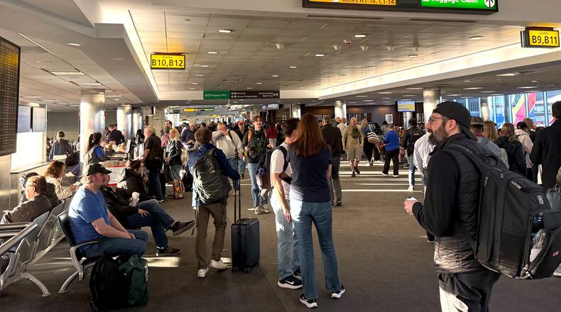 Stranded travelers crowd the Southwest domestic terminal at Baltimore-Washington International Thurgood Marshall Airport on Friday, March 13, 2026, after a ground stop. (Ellie Wolf/The Baltimore Banner via AP)