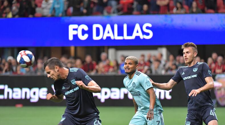 April 20, 2019 Atlanta - FC Dallas defender Matt Hedges (24) heads the ball during MLS soccer match at Mercedes-Benz Stadium  in Atlanta on Wednesday, April 20, 2019. HYOSUB SHIN / HSHIN@AJC.COM
