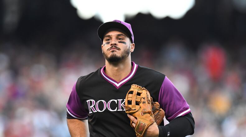Nolan Arenado signed an eight-year, $260 million extension with the Rockies.
