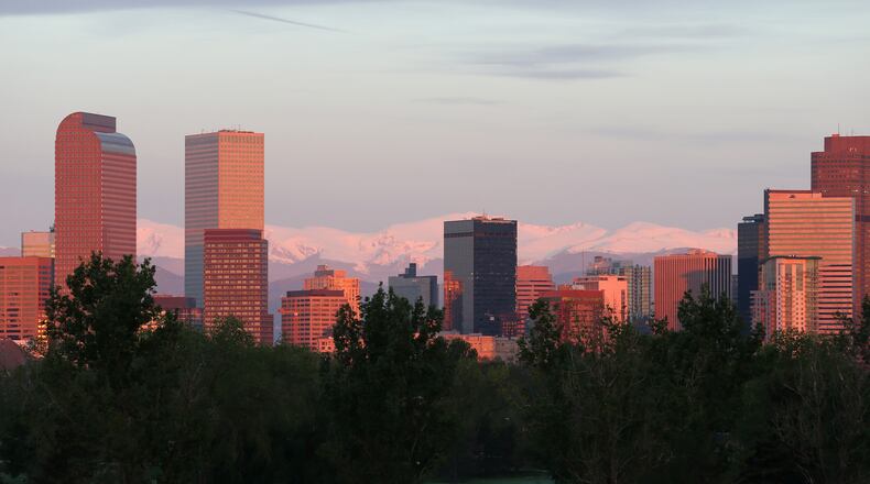 Downtown Denver with the Rockies as a backdrop.