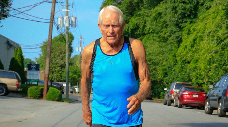 A common sight these last 50-plus years: Bill Thorn working up a sweat on some Atlanta area street. (Photo by Warren Travers/Atlanta Track Club)