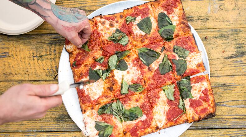 The Grandma Pie is a chewy, crispy, saucy, cheesy study in delicious simplicity. Photo Credit- Mia Yakel. Styling Credit- Anthony Spina.