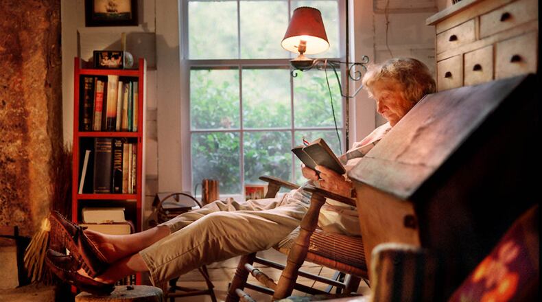 ROSWELL, GA. : Celestine Sibley reads 'Daily Strengths for Daily Needs' a book containing scripture, poetry & early New England philosophers work. Photo taken at her Sweet Apple cabin. (AJC Staff Photo/Joey Ivansco, October 1997)