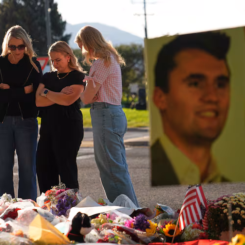 FILE - Women pray at a memorial outside Utah Valley University after Turning Point USA CEO and co-founder Charlie Kirk was shot and killed, Sept. 13, 2025, in Orem, Utah. (AP Photo/Lindsey Wasson, File)