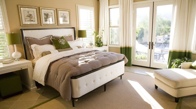 A new coat of light color paint can give your room a larger, airier look. (Dreamstime)