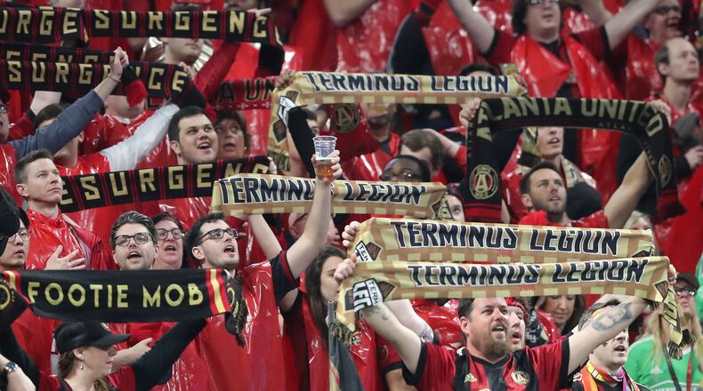 March 11, 2018 Atlanta: A Atlanta United fan toasts the team as they take on the D.C. United during their home opener in a MLS soccer game on Sunday, March 11, 2018, in Atlanta.    Curtis Compton/ccompton@ajc.com