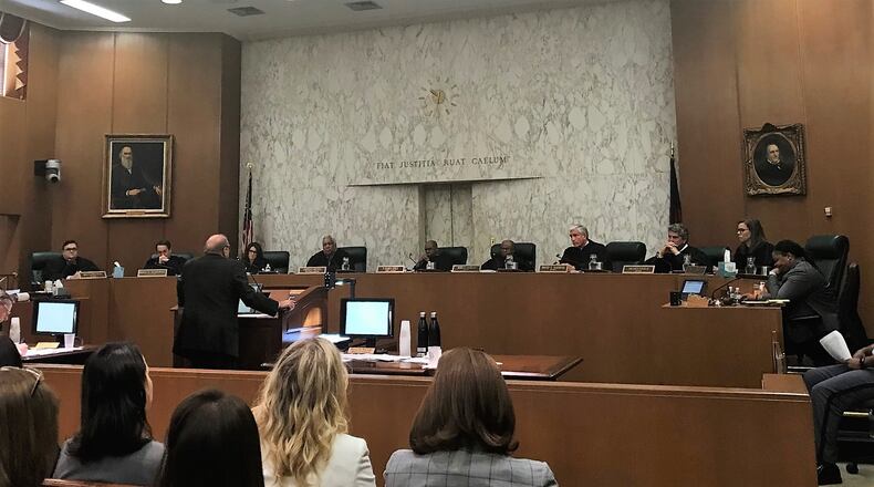 The Georgia Supreme Court listens to oral arguments on a case involving a man who said he was arrested twice because of errors by employees at the now-dissolved DeKalb Recorder’s Court.