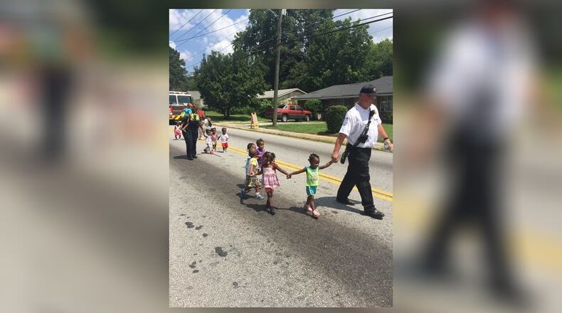 Children were led out of a northwest Atlanta day care after after a gas leak was reported next door. (Credit: Atlanta fire spokesman Cortez Stafford)