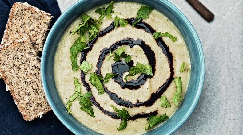 Here, Creamy Parsnip Pear Soup is finished with a swirl of a balsamic reduction and a sprinkle of fresh parsley. Reprinted with permission from “Awesome Vegan Soups” by Vanessa Croessmann, Page Street Publishing Co., 2019. CONTRIBUTED BY VANESSA CROESSMANN