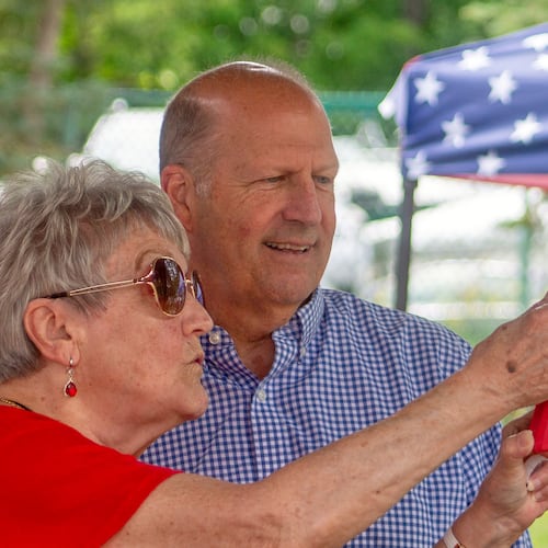 Former Sen. John E. Sununu, who is seeking the GOP nomination for his old seat, takes a selfie with supporter Sudie Francouer, in Berlin, N.H., Saturday, Aug. 22, 2026. (AP Photo/Holly Ramer)