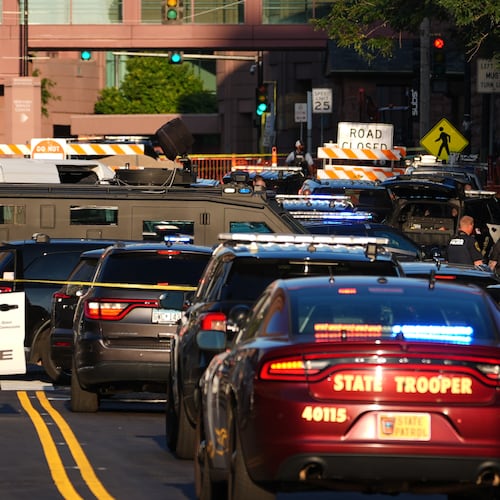 Law enforcement respond to a shooting Wednesday, Sept. 2, 2026, in downtown Minneapolis. (AP Photo/Ellen Schmidt)