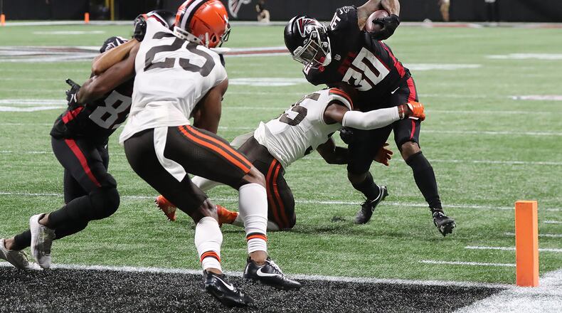 Falcons running back Qadree Ollison makes a long gain but is stopped short of the end zone by Cleveland Browns safety Jovante Moffatt during the second half Sunday, August 29, 2021, in Atlanta. “Curtis Compton / Curtis.Compton@ajc.com”