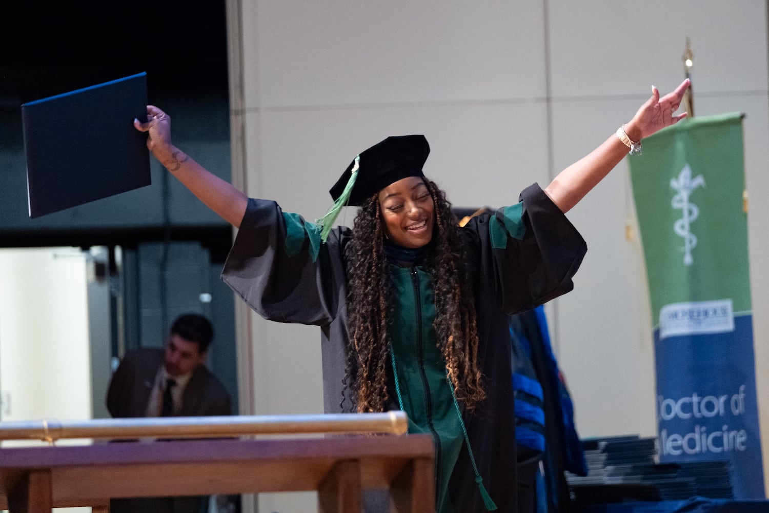Dr. Janya Oglesby reacts after receiving her diploma during the Morehouse School of Medicine graduation ceremony on Saturday, May 16, 2026, in Atlanta. (Ben Gray for the AJC)