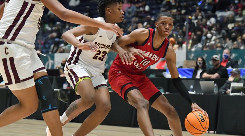 Sandy Creek's Jabari Smith (10) dribbles against Cross Creek's Antoine Lorick (23) during the Class 3A boys championship game Friday, March 12, 2021, in Macon. Cross Creek won 57-49. (Hyosub Shin / Hyosub.Shin@ajc.com)