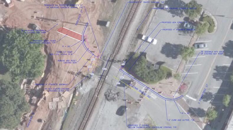 Norcross will survey for pedestrian crossings at four railroad crossing locations: Rowan Street, Park Drive/Jones Street Crossing, Autry Street, and Holcomb Bridge Road (shown). (Courtesy City of Norcross)