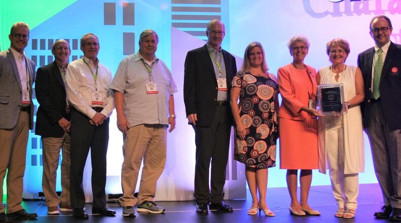 Lawrenceville Mayor Judy Jordan Johnson, third from right, receives the town’s Georgia Municipal Association ‘City of Ethics’ plaque from Auburn Mayor Linda Blechinger. Courtesy Georgia Municipal Association