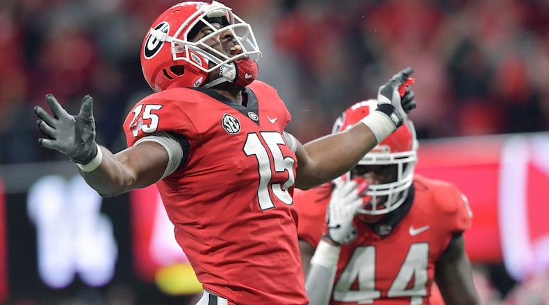 Georgia linebacker D'Andre Walker (15) celebrates during the SEC Championship game at Mercedes-Benz Stadium on Saturday, December 1, 2018. HYOSUB SHIN / HSHIN@AJC.COM
