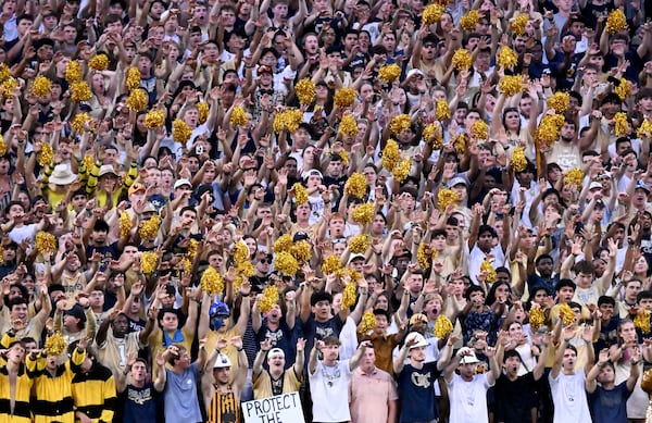 Apropos of, uh, absolutely nothing: Check out this beautiful photo of a diverse group of college students enjoying their football game. (Hyosub Shin/AJC)