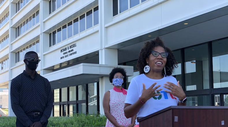 Wanda Mosley of Black Voters Matter speaks on Tuesday, July 14, 2020, outside the Richard B. Russell Federal Building in Atlanta about a lawsuit seeking changes to elections to the Georgia Public Service Commission. Mosley is surrounded by other plaintiffs in the lawsuit, Georgia NAACP President James Woodall and Briont McCorkle of Georgia Conservation Voters. MARK NIESSE / MARK.NIESSE@AJC.COM