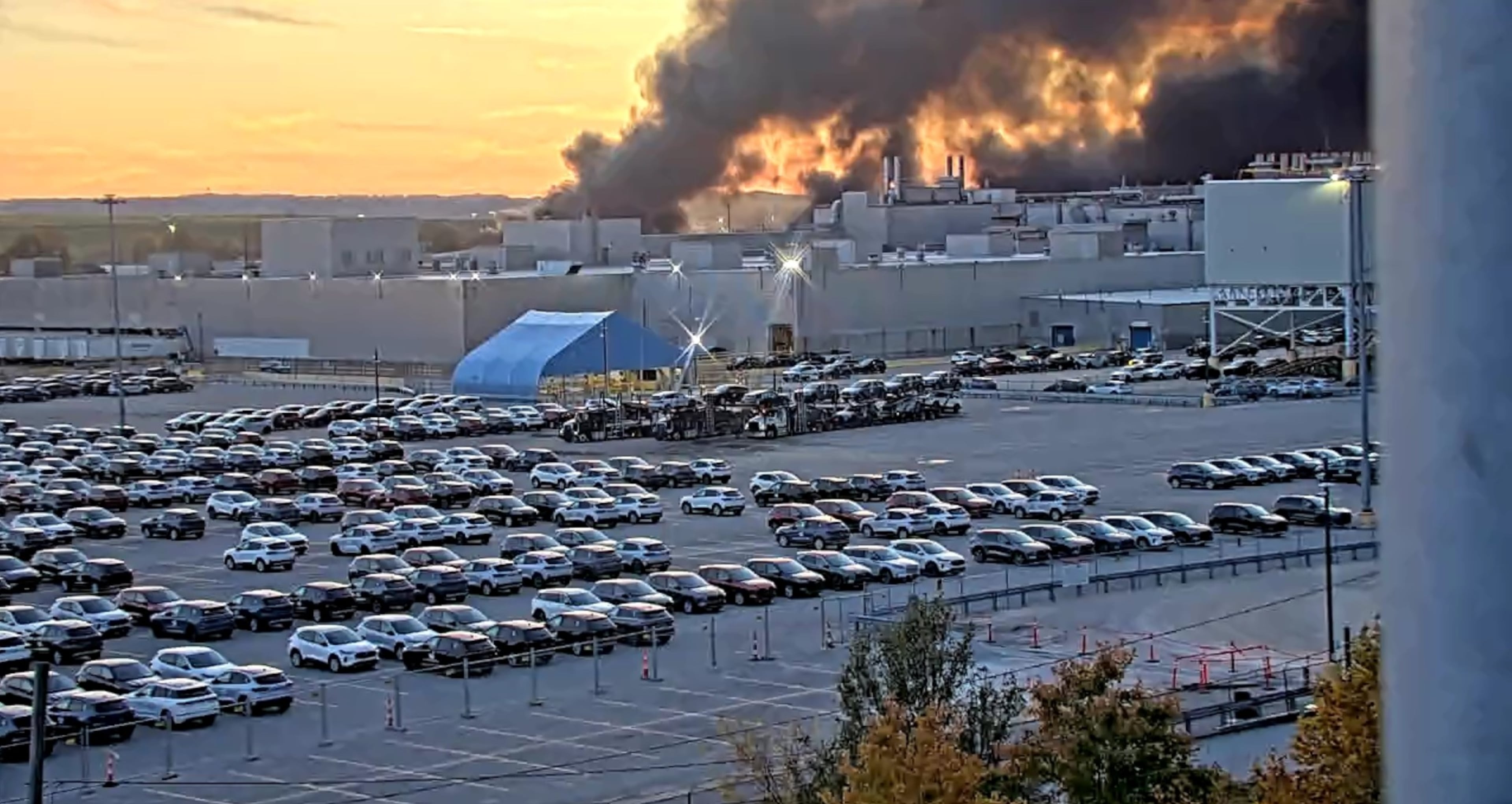 A Kentucky Department of Transportation camera captured a plume of smoke rising above Louisville International Airport on Tuesday. UPS Flight 2976 crashed after taking off, the FAA confirmed. (Screen grab of a Kentucky Department of Transportation traffic camera)