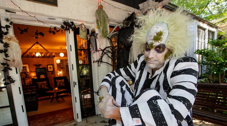 Ash Parker is ready for Halloween with his Beetlejuice costume at his Morningside home.  (Jenni Girtman for The Atlanta Journal-Constitution)