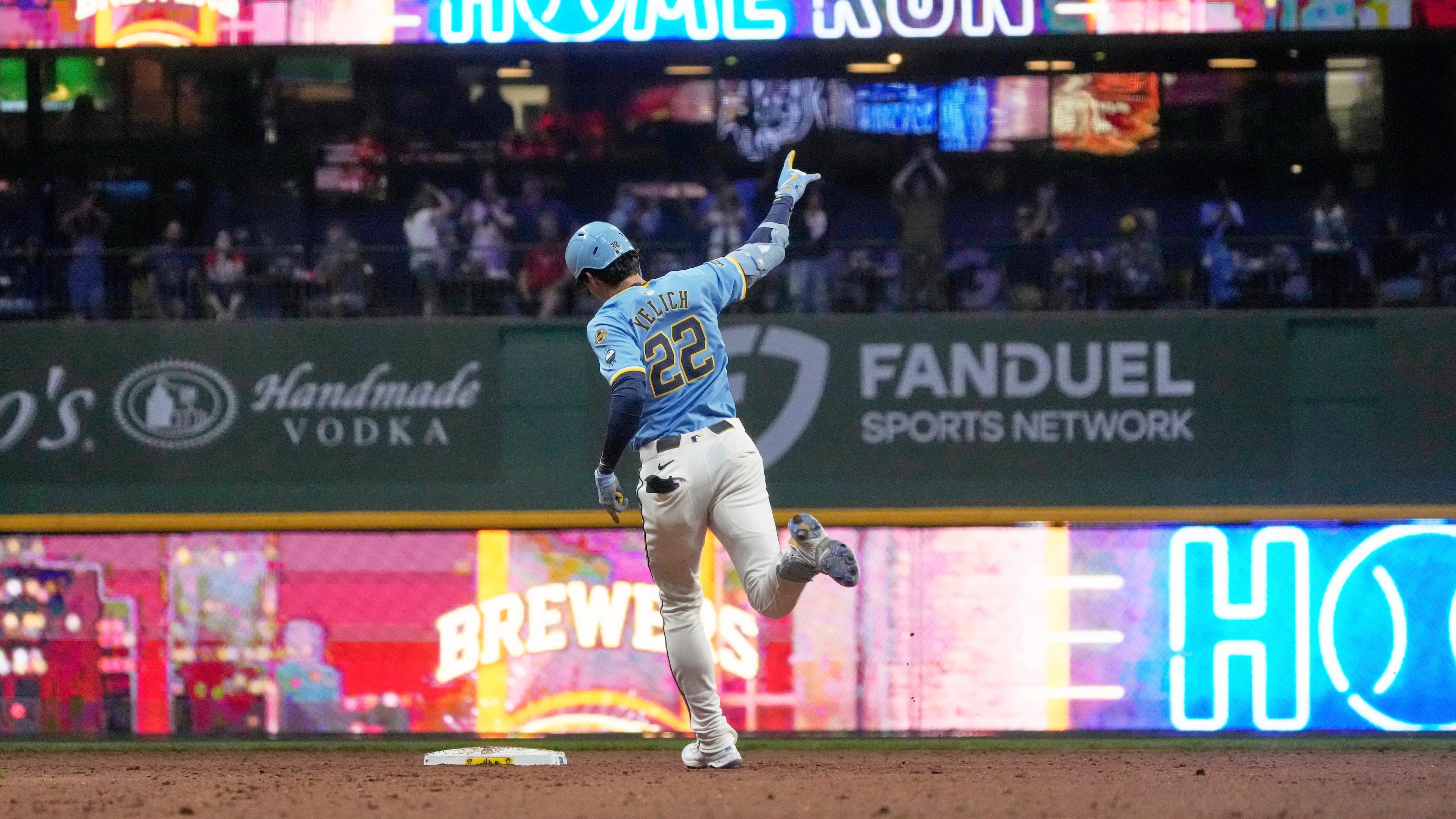 Milwaukee Brewers' Christian Yelich hits a two-run home run during the seventh inning of a baseball game against the St. Louis Cardinals Friday, Sept. 12, 2025, in Milwaukee. (AP Photo/Morry Gash)