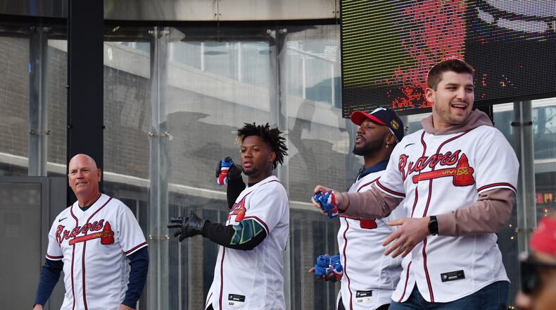 Atlanta Braves (from left) manger Brian Snitker, right fielder Ronald Acuña, center fielder Michael Harris and third baseman Austin Riley throw free t-shirts during Braves Fest Opening Rally at Georgia Power Pavilion Stage in The Battery Atlanta, Saturday, Jan. 21, 2023, in Atlanta. After not holding the event for several years due to the pandemic, the team bought back the fan event Saturday. (Hyosub Shin/The Atlanta Journal-Constitution/TNS)