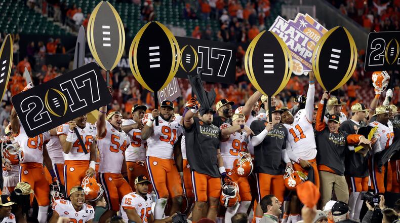 Clemson players celebrate after winning the College Football Playoff championship game against Alabama Tuesday, Jan. 10, 2017, in Tampa, Fla. Clemson won 35-31.