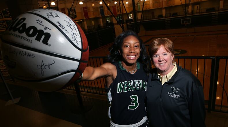 Mikayla Coombs (left) and her basketball coach Jan Azar (right) of Weslayan School pose for a portrait at Wesleyan School on May 8, 2017. Coombs will attend the University of Connecticut on a basketball scholarship. While her school was the Class A state champions, she was named Miss Georgia Basketball and will also be trying out for the U.S. U-19 team, which narrows down to twelve players and the try-outs are invite only. (HENRY TAYLOR / HENRY.TAYLOR@AJC.COM)