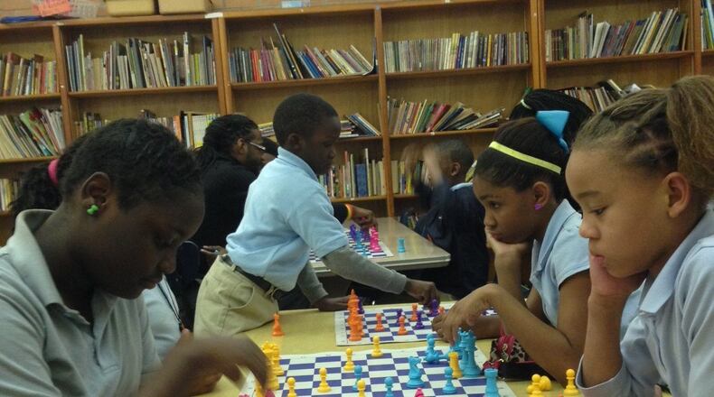 Fifth graders Vandasia Louis, 11, and Jerrinya Smith, 11, play chess at Baton Rouge's Celerity Lanier Charter School. Jaime Sarrio jsarrio@ajc.com