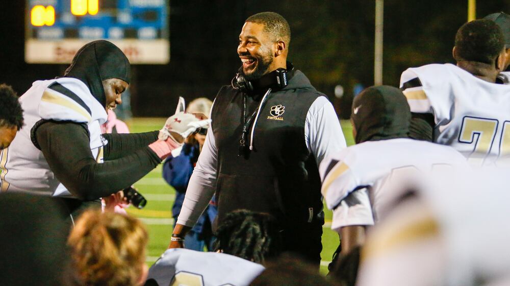 Greene County head football coach Darius Robinson, seen here celebrating with his team after a win in October, was relieved of coaching duties after his arrest, the Greene County School District said. (Lance McCurley/Lake Oconee News)