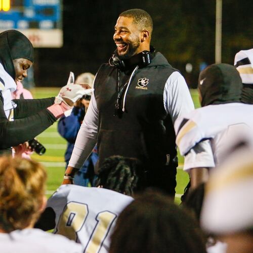 Greene County head football coach Darius Robinson, seen here celebrating with his team after a win in October, was relieved of coaching duties after his arrest, the Greene County School District said. (Lance McCurley/Lake Oconee News)