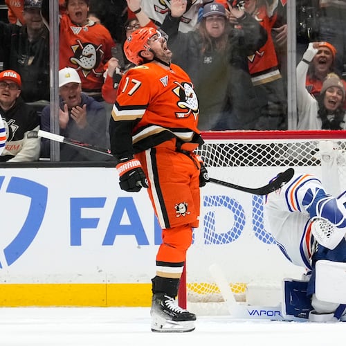 Anaheim Ducks left wing Alex Killorn, left, celebrates his goal as Edmonton Oilers goaltender Connor Ingram sits in goal during the second period of Game 3 in the first round of the NHL hockey Stanley Cup playoffs series Friday, April 24, 2026, in Anaheim, Calif. (AP Photo/Mark J. Terrill)