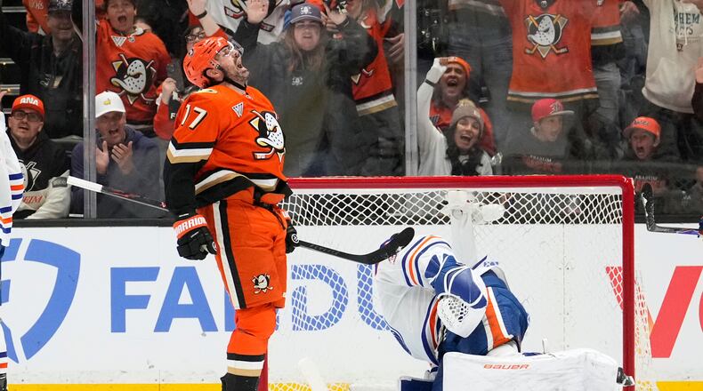 Anaheim Ducks left wing Alex Killorn, left, celebrates his goal as Edmonton Oilers goaltender Connor Ingram sits in goal during the second period of Game 3 in the first round of the NHL hockey Stanley Cup playoffs series Friday, April 24, 2026, in Anaheim, Calif. (AP Photo/Mark J. Terrill)