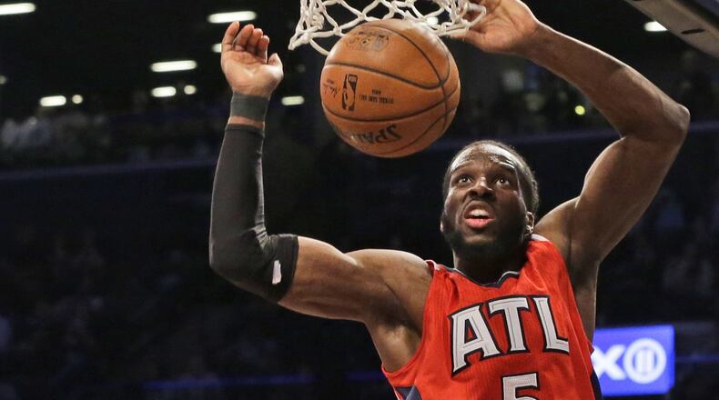 Atlanta Hawks forward DeMarre Carroll dunks during the second half in Game 3 of a first-round NBA basketball playoff series against the Brooklyn Nets, Saturday, April 25, 2015, at New York. The Nets won 91-83. (AP Photo/Mary Altaffer)