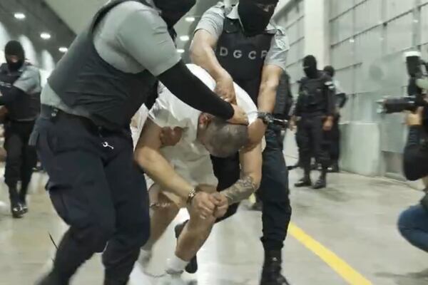 In this undated photo provided by the U.S. District Court for the District of Maryland, a man identified by Jennifer Vasquez Sura as her husband, Kilmar Abrego Garcia, is led by force by guards through the Terrorism Confinement Center in Tecoluca, El Salvador. (U.S. District Court for the District of Maryland via AP)