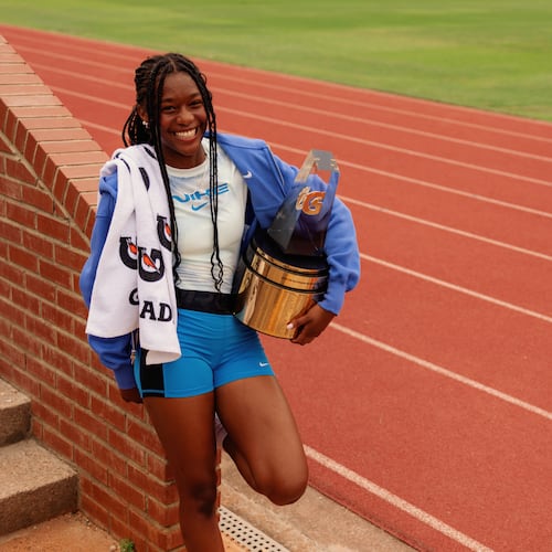 Melanie Doggett holds the Gatorade national girls track-and-field national athlete-of-the-year trophy, presented to her at her school, Landmark Christian, on Thursday. (Courtesy of Gatorade)