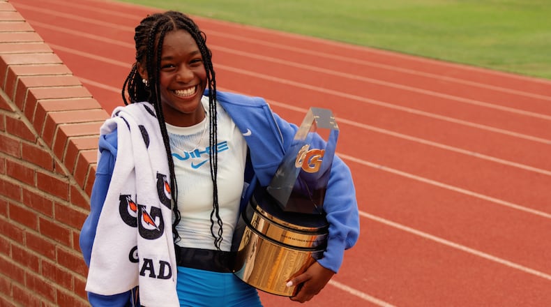 Melanie Doggett holds the Gatorade national girls track-and-field national athlete-of-the-year trophy, presented to her at her school, Landmark Christian, on Thursday. (Courtesy of Gatorade)