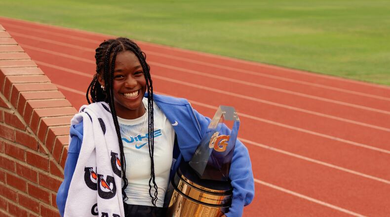 Melanie Doggett holds the Gatorade national girls track-and-field national athlete-of-the-year trophy, presented to her at her school, Landmark Christian, on Thursday. (Courtesy of Gatorade)